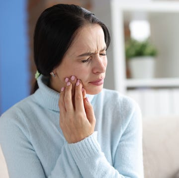 Young woman with severe toothache at home young woman with severe toothache at home