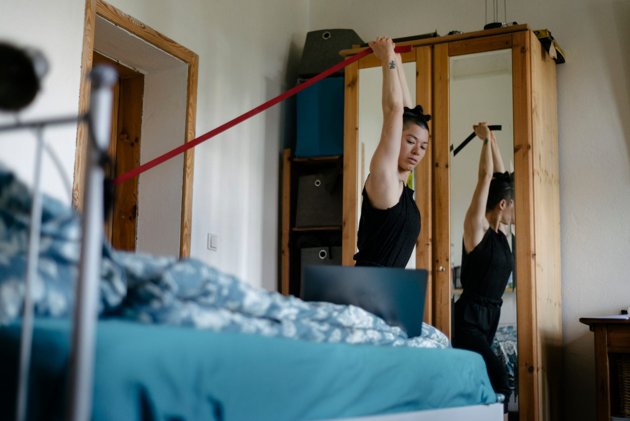 young woman working out with resistance band