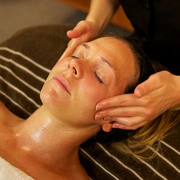 a young women receiving facial beauty treatment in a beauty spa