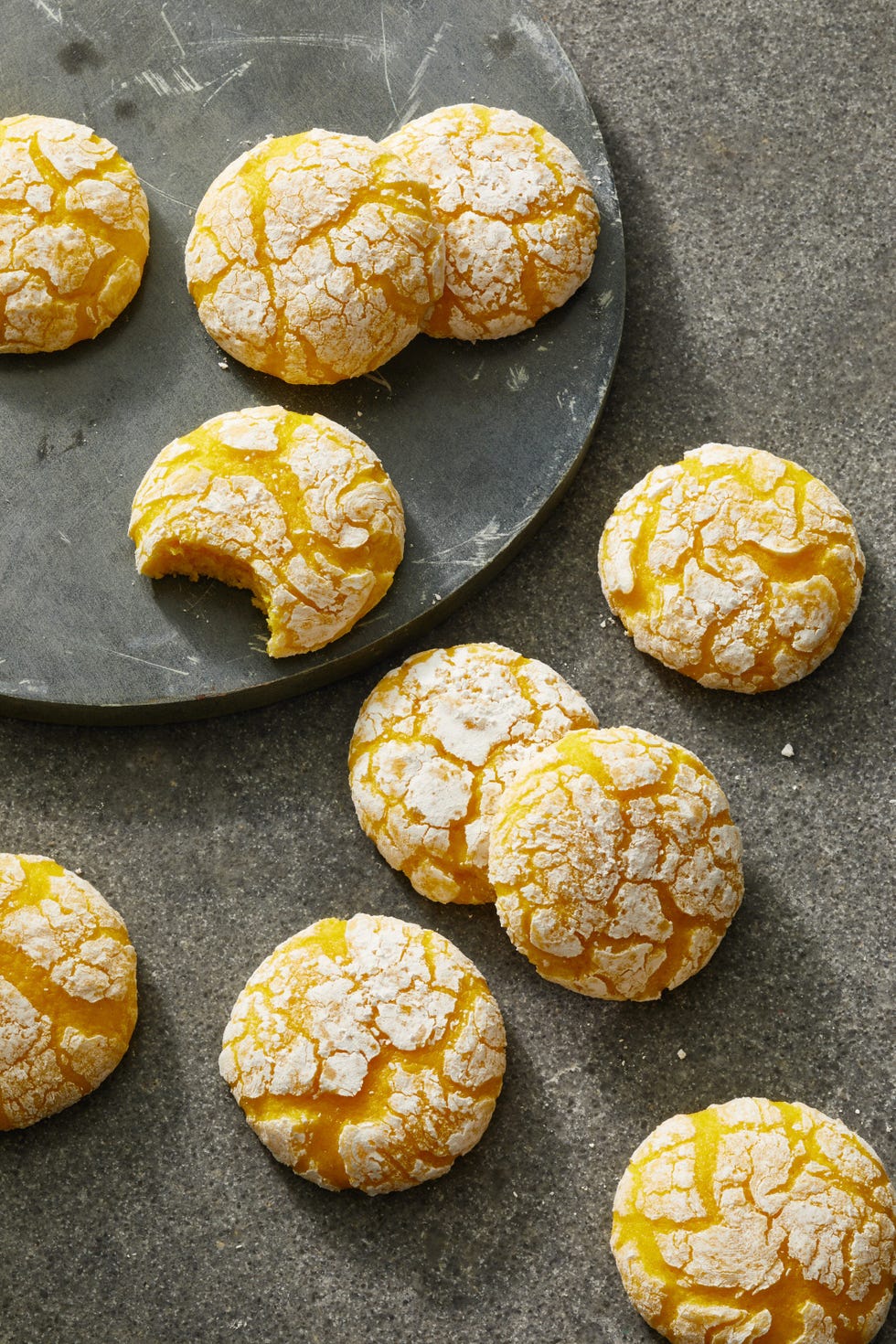 yuzu crinkle cookies with confectioners' sugar sprinkled on top