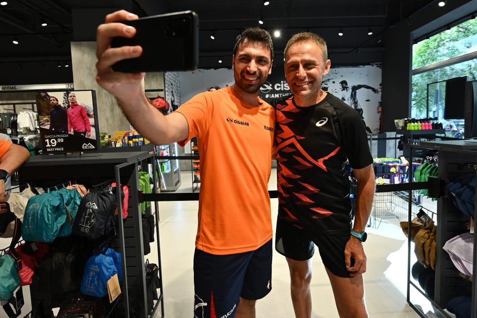 a couple of men posing for the camera