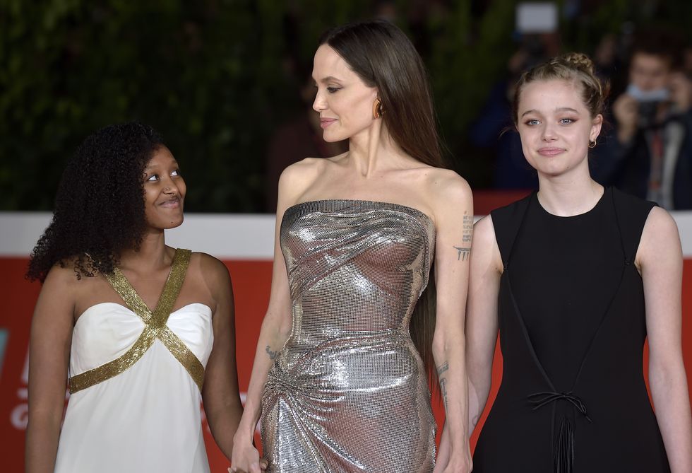 angelina jolie versace dress with daughters zahara marley jolie pitt and shiloh jolie pitt at rome film fest 2021 eternals red carpet rome italy, october 24th, 2021 photo by rocco spazianiarchivio spazianimondadori portfolio via getty images
