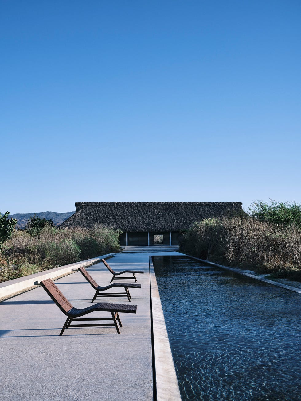 zara home x vincent van duysen loungers by pool