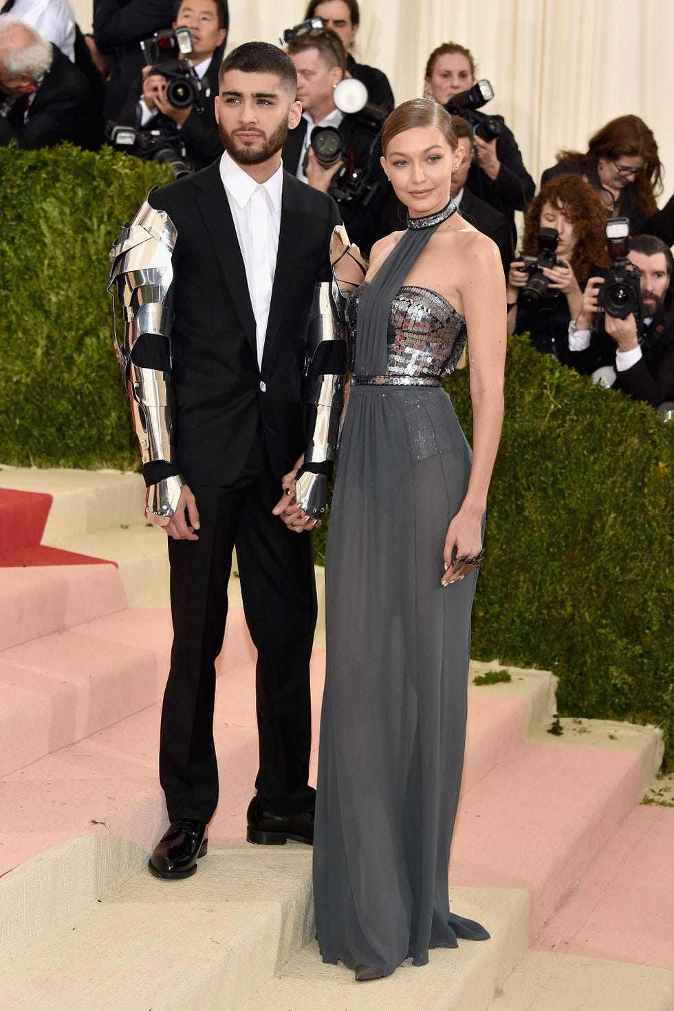 zayn malik and gigi hadid hold hands and pose on steps