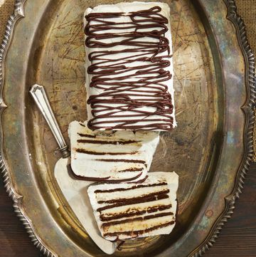zebra semifreddo drizzled in chocolate on a vintage silver platter