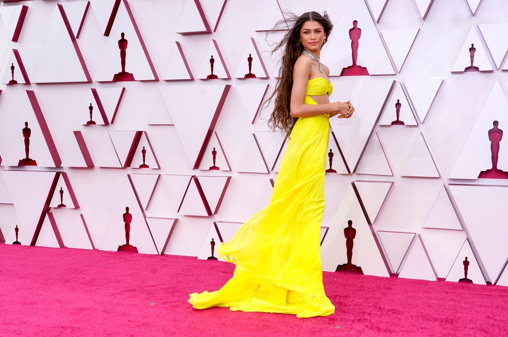 Zendaya arrives at Louis Vuitton in dangerously low-cut zipper gown