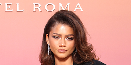 Zendaya sparkles in a see-through mesh top and glitter suit