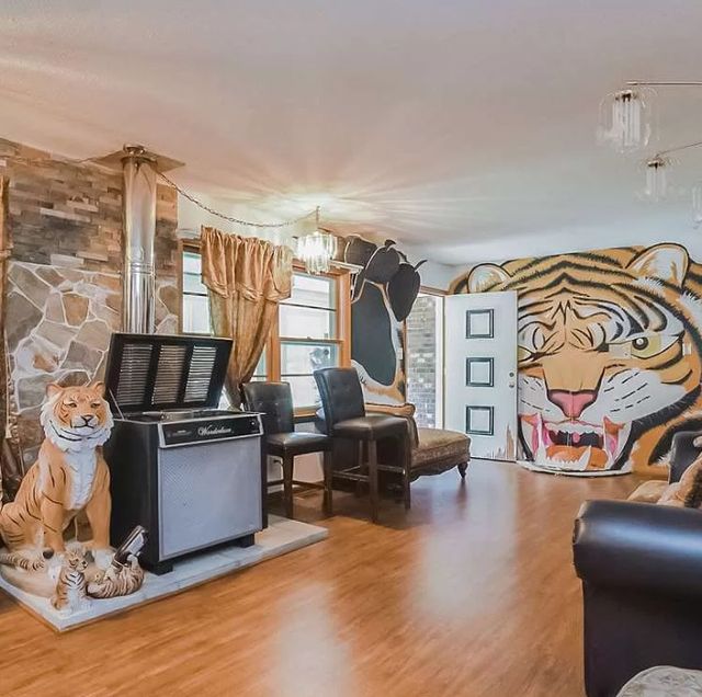 a tiger king esque room, as seen in a house featured on zillowgonewild's instagram account