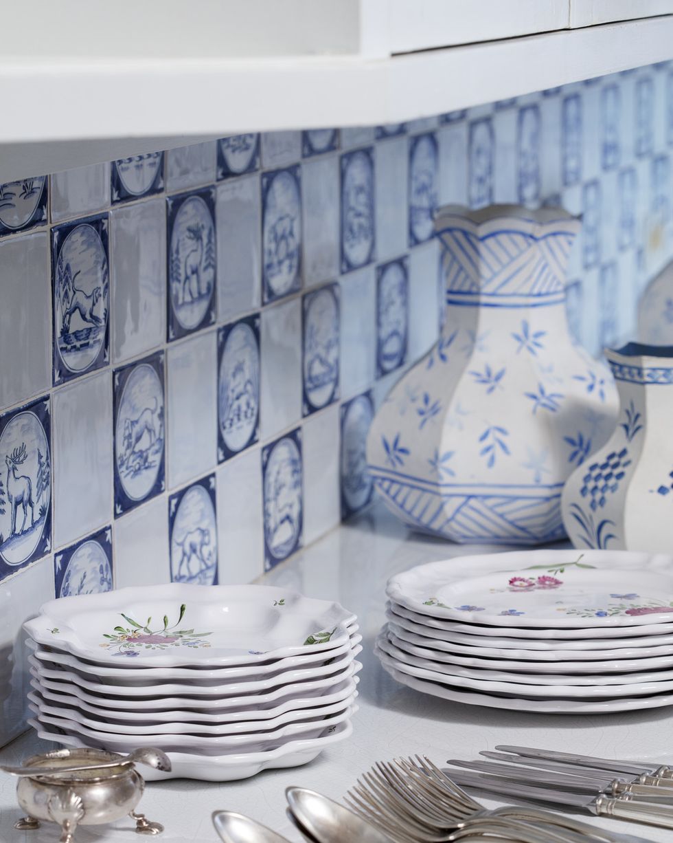 the château’s butler’s pantry resplendent with german tile serves as an enchanting staging area