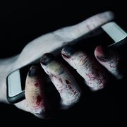 zombie with a smartphone in his hand
