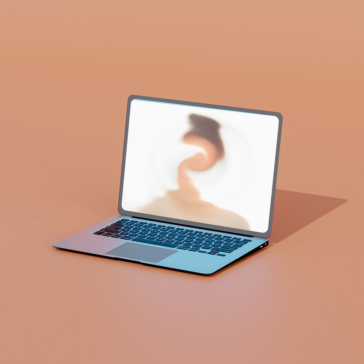 computer generated image of a laptop with blurred face on screen