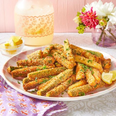 fried zucchini with lemon wedges