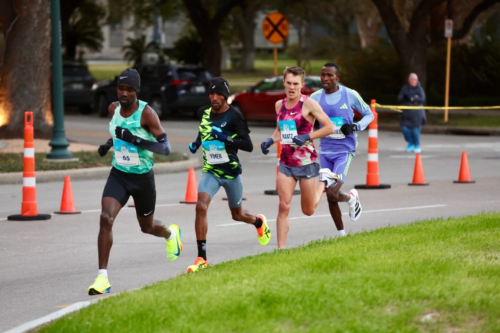 runners participating in a competitive race on a city street