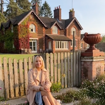 a person sitting on a fence