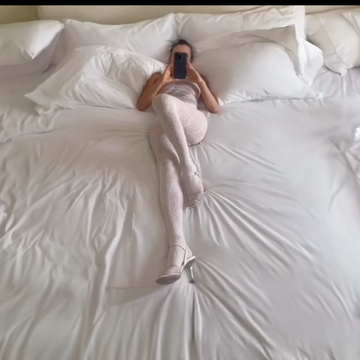a person lying on a bed
