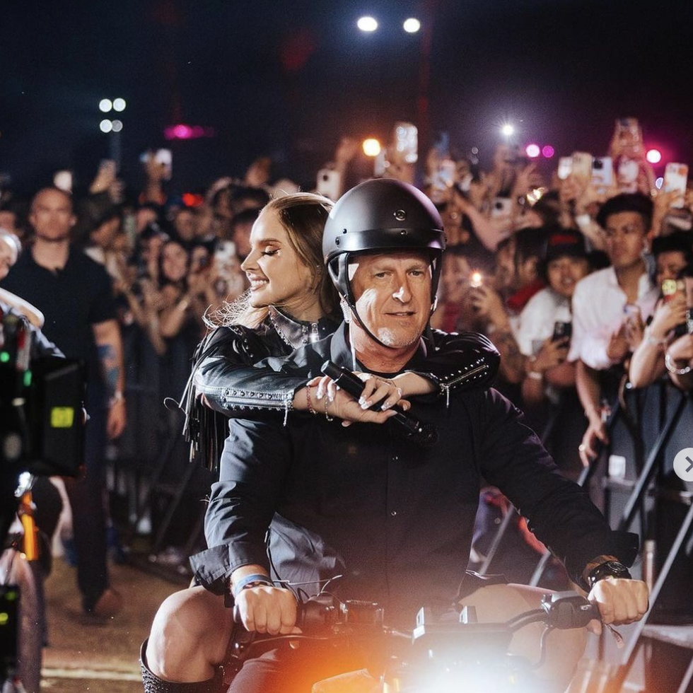 a man and woman on a motorcycle