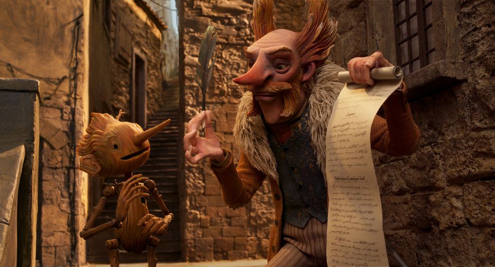 guillermo del toro's pinocchio l r pinocchio voiced by gregory mann and count volpe voiced by christoph waltz cr netflix © 2022