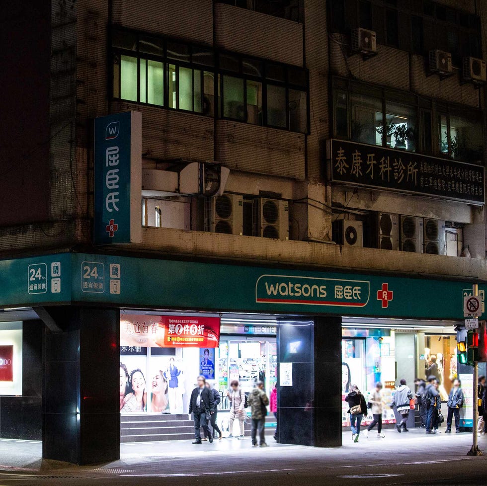 a group of people stand outside a building