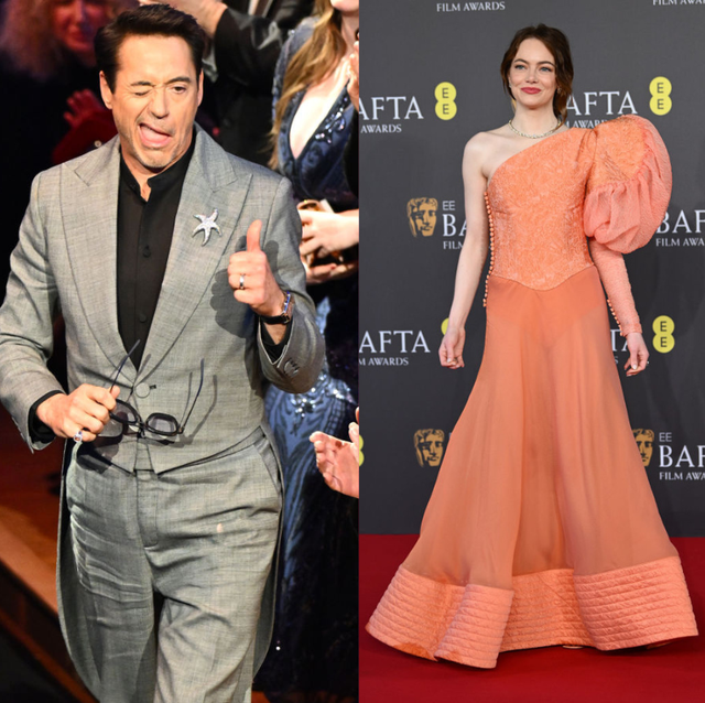 a man and woman walking down a red carpet