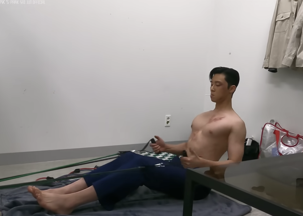 a person sitting on a bed