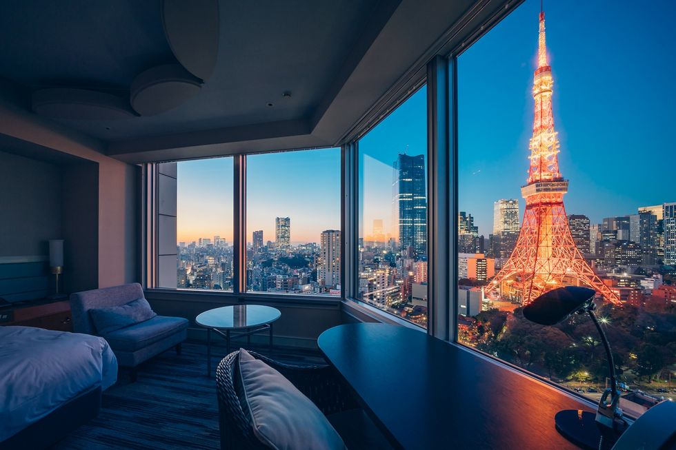 a room with a tall tower in the background