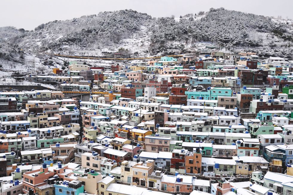 a city with snow on the mountain