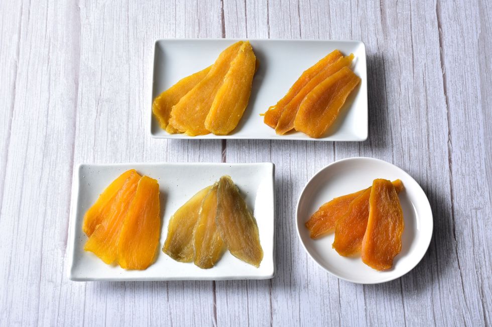 a group of orange slices on plates