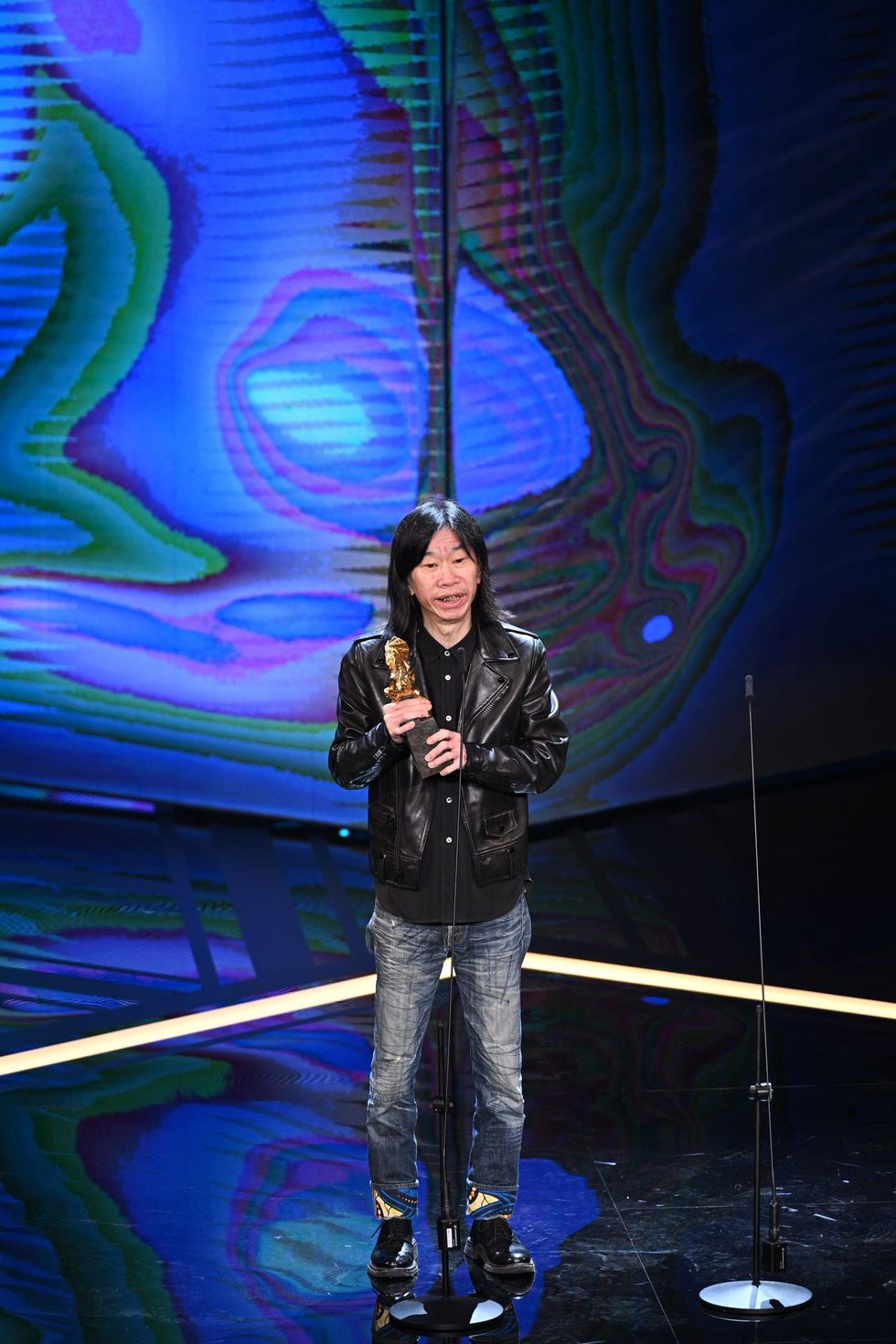 a person standing on a stage