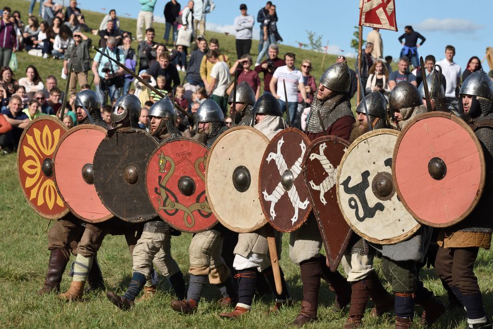 kernave, lithuania   july 6 unidentified people in a medieval fights at international festival of experimental archeology on july 6 2019 its a most popular folklore event on july in lithuania