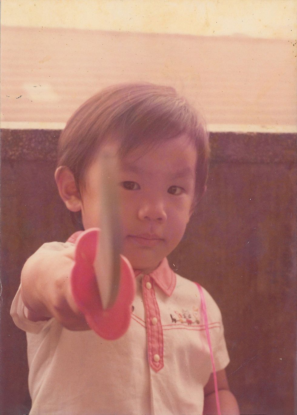 a child holding a toy