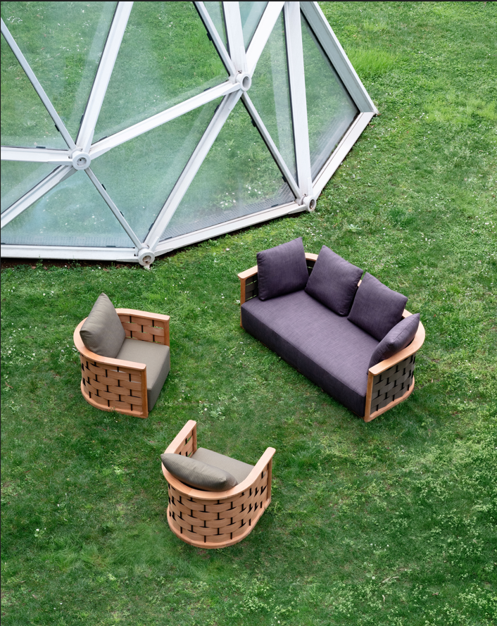 a couple of chairs on the grass