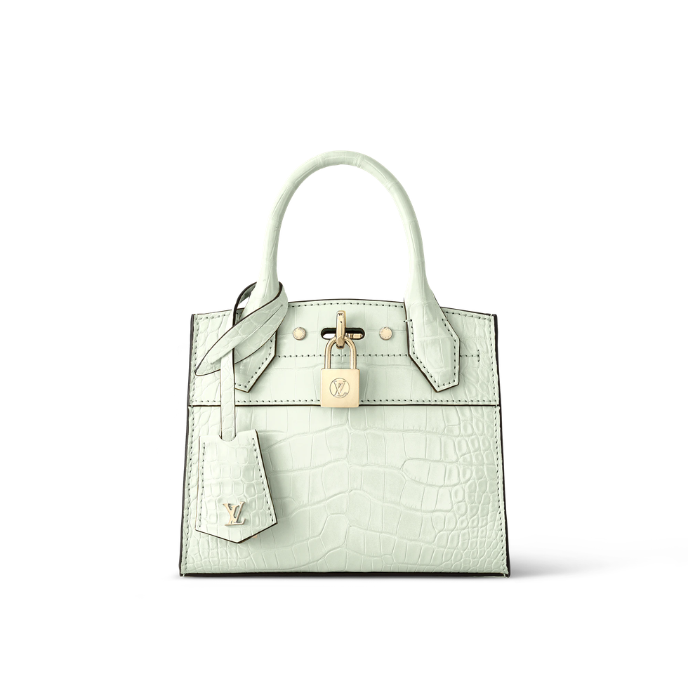 a white handbag with a strap
