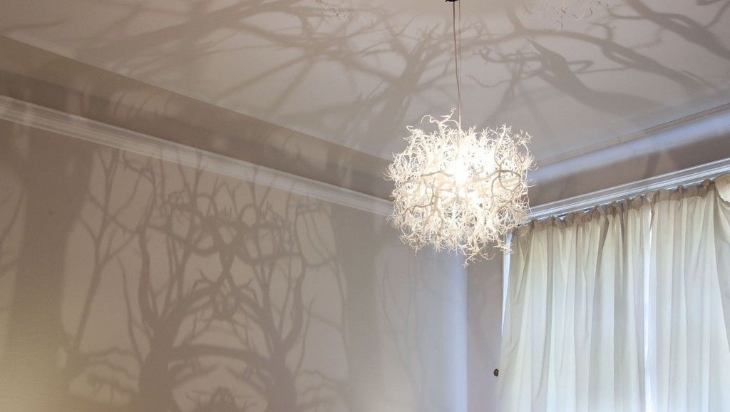 chandelier that turns room into haunted woods