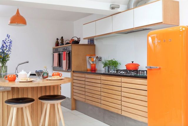 Kitchen renovation in Waddingham using retro Danish styling and an orange Smeg fridge