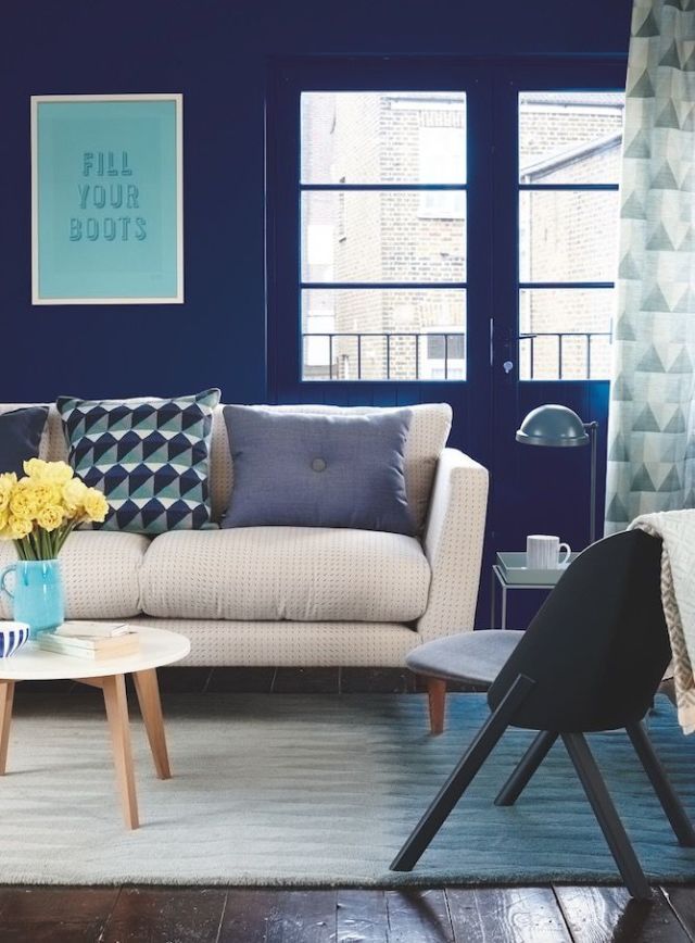 Deep blue hue furniture walls with modern geometrics