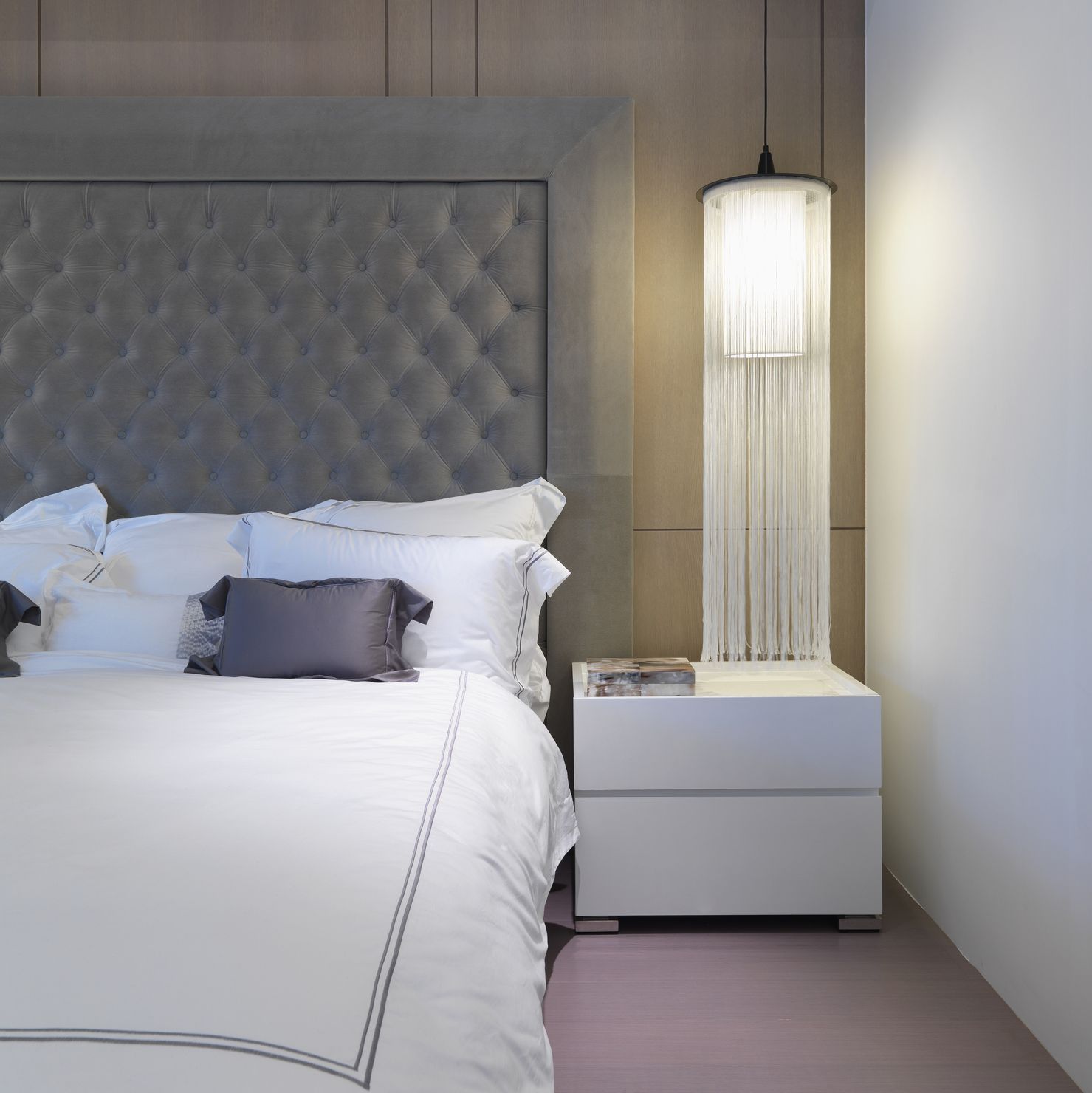 White bed with elegant headboard