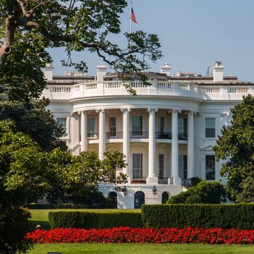 The White House in Washington DC, United States of America - picture shows the house in front of lawn against sky