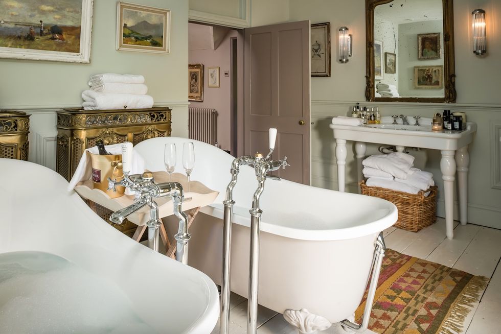 Unique Home Stays: Darcy House stone cottage bathroom - twin bathtub sets