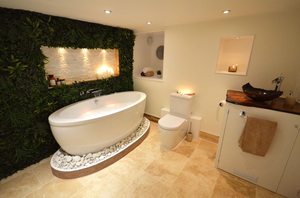 Interior designer Lili Giacobino 's bathroom with a vertical garden wall and luxury spa feel