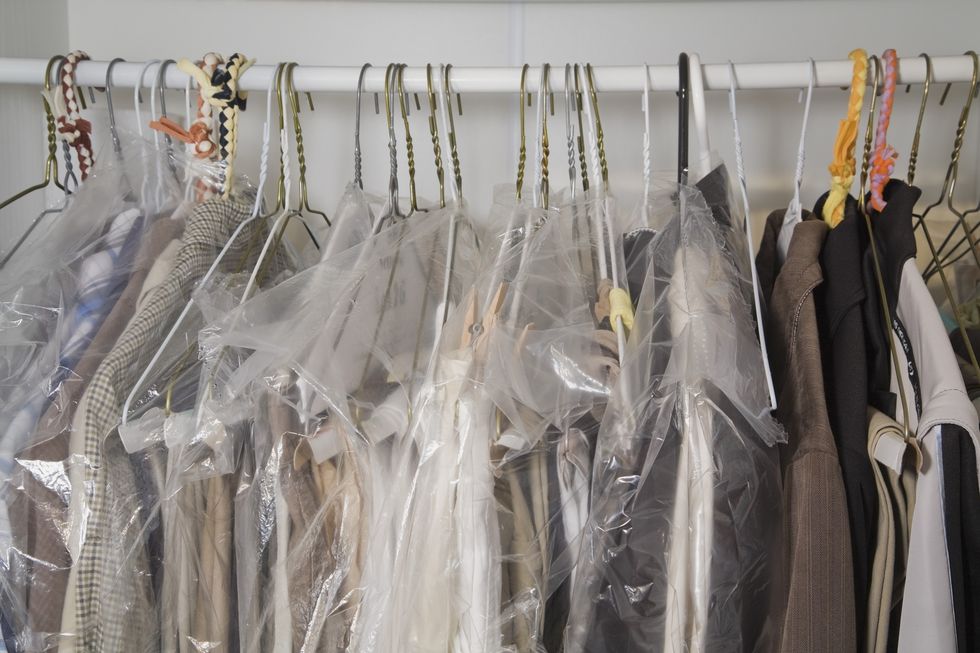 Summer Clothes Stored Away On Hangers In A Closet