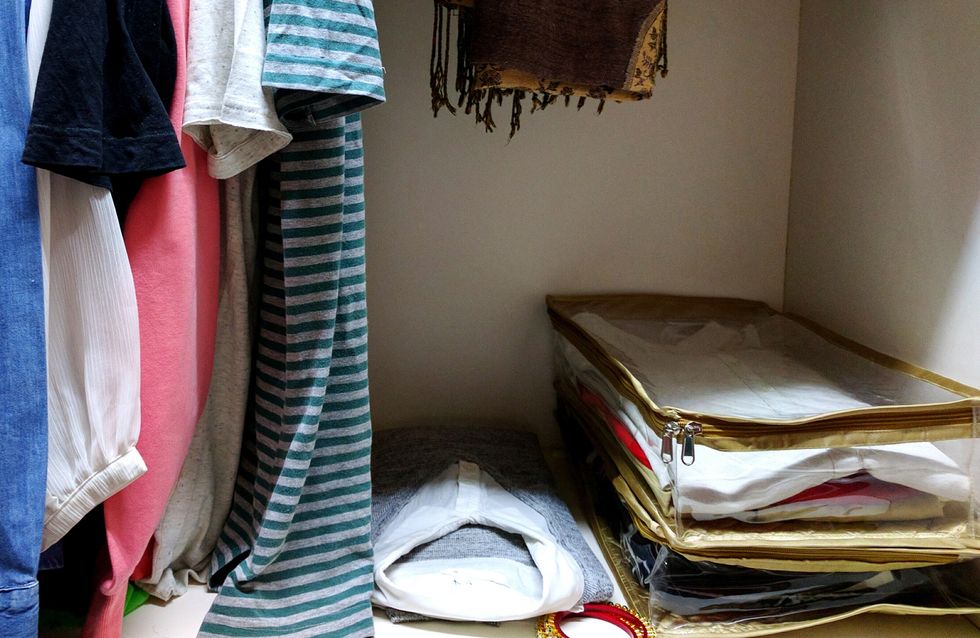 Clothes Hanging In Closet At Home