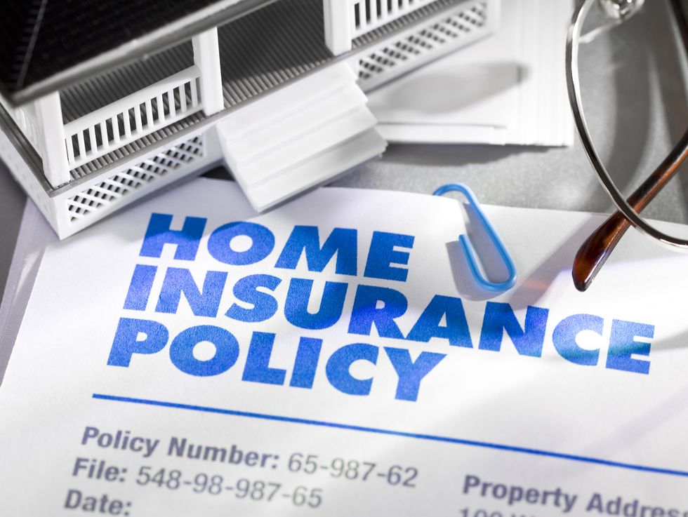 Home Insurance Policy with house and glasses. Numbers and text are fictitious