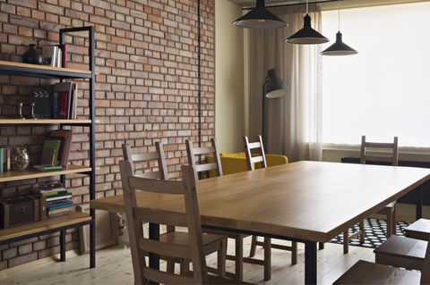 Dining table and brick feature wall