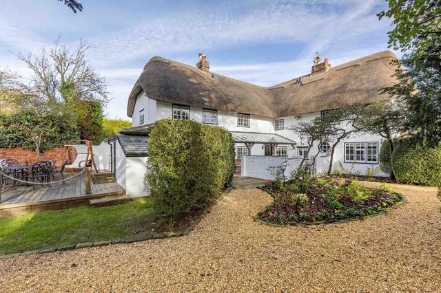 Thatched white cottage inspired by Goldilocks and the Three Bears.