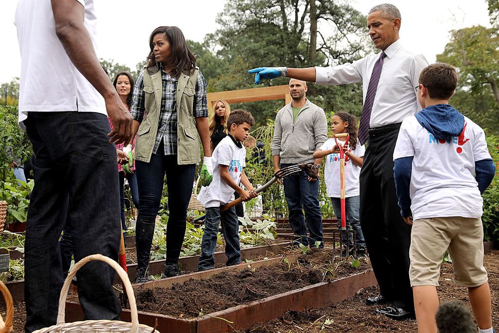 U.S. First Lady Michelle Obama and President Barack Obama host an event to harvest the White House Kitchen Garden on the South Lawn of the White House October 6, 2016 in Washington, DC
