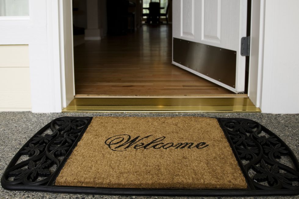 Welcome mat entrance new home door wood floor clean inviting