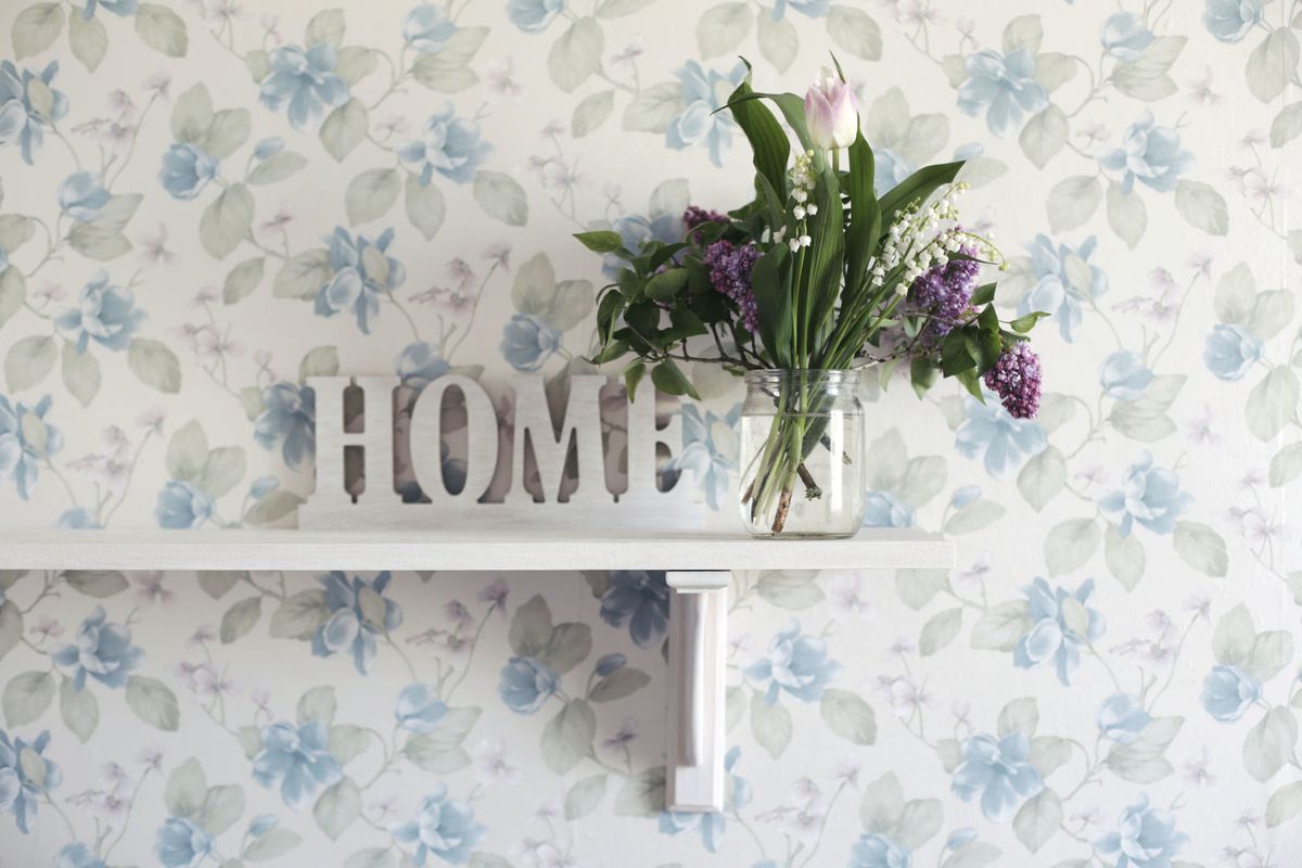 Flower Vase On Shelf At Home with Sign