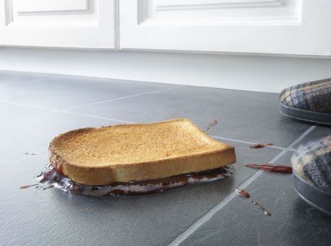 Unlucky toast with jam on kitchen floor