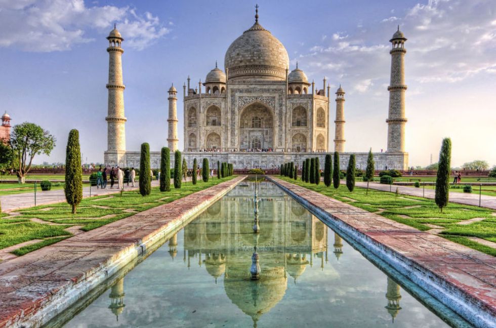 Landmark, Reflecting pool, Reflection, Historic site, Building, Holy places, Wonders of the world, Tourist attraction, Mausoleum, Symmetry, 