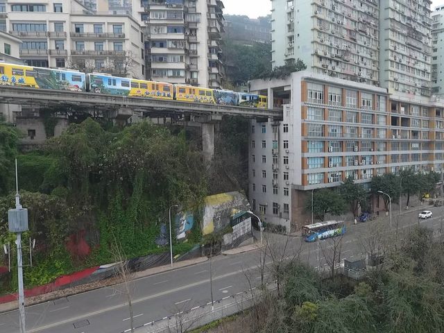 This train in China runs directly through a block of flats